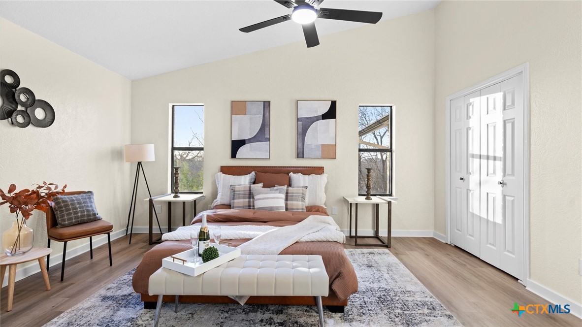 300 Ridge Crest Drive Seguin, TX 78155 - Photo 15 of 33 a bedroom with a bed and wooden floor