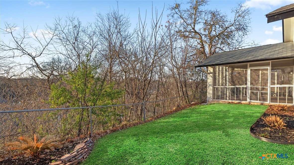 300 Ridge Crest Drive Seguin, TX 78155 - Photo 20 of 33 a view of a backyard with large trees and plants