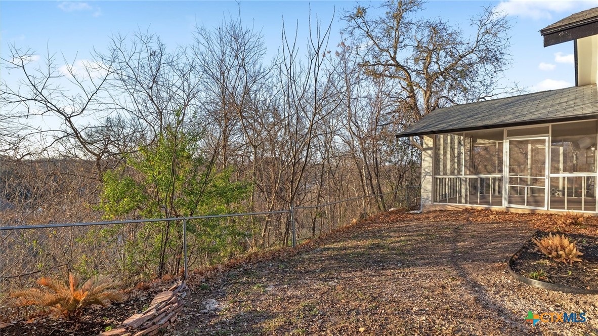 300 Ridge Crest Drive Seguin, TX 78155 - Photo 21 of 33 a view of a backyard with large trees