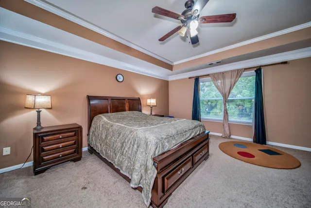 a bed room with a bed and a chandelier