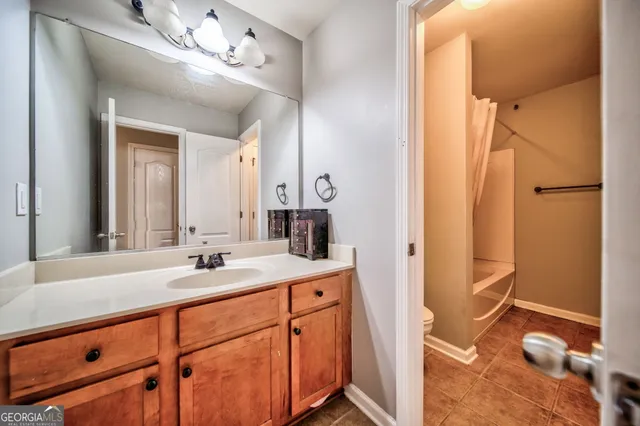 a bathroom with a sink double vanity and a mirror
