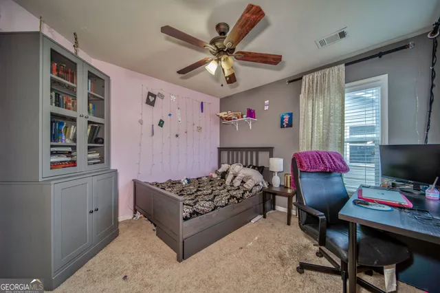 a bedroom with furniture and a bed