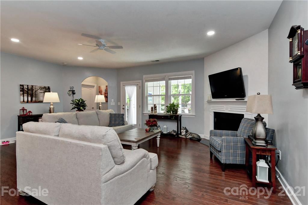 4978 Samoa Ridge Drive Lancaster, SC 29720 - Photo 18 of 38 a living room with fireplace furniture and a flat screen tv