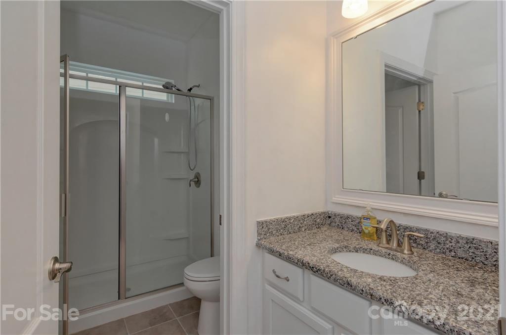 4978 Samoa Ridge Drive Lancaster, SC 29720 - Photo 20 of 38 a bathroom with a granite countertop sink toilet and shower