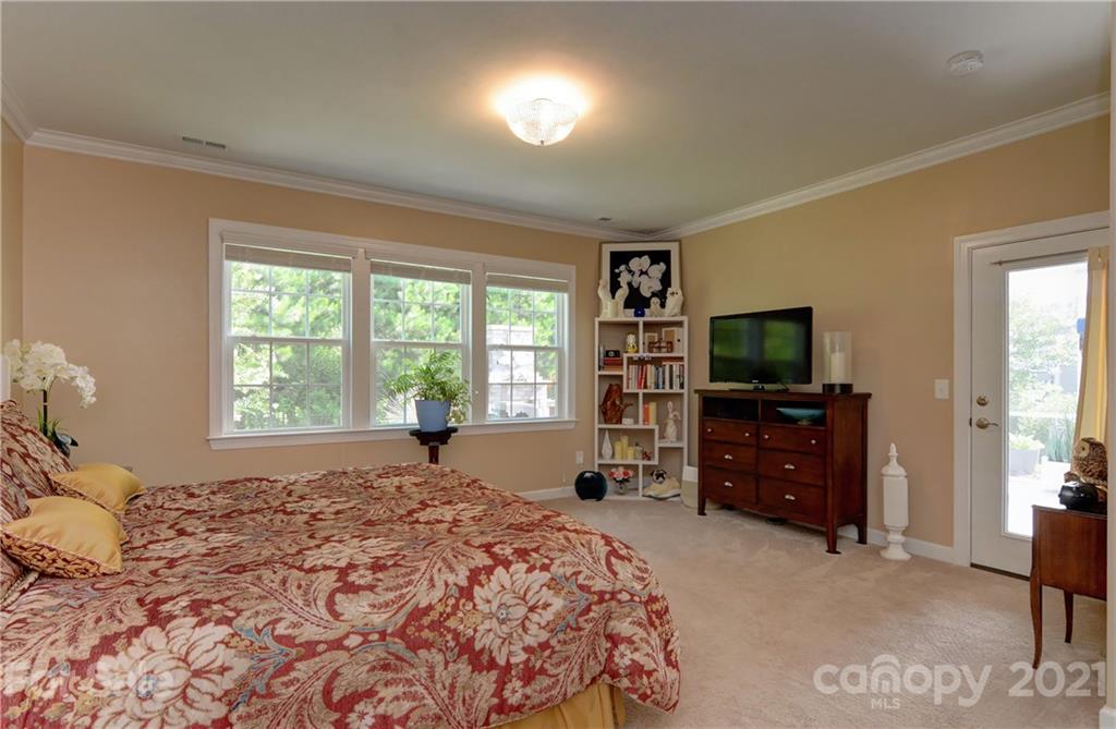 4978 Samoa Ridge Drive Lancaster, SC 29720 - Photo 22 of 38 a bedroom with a bed and a flat screen tv