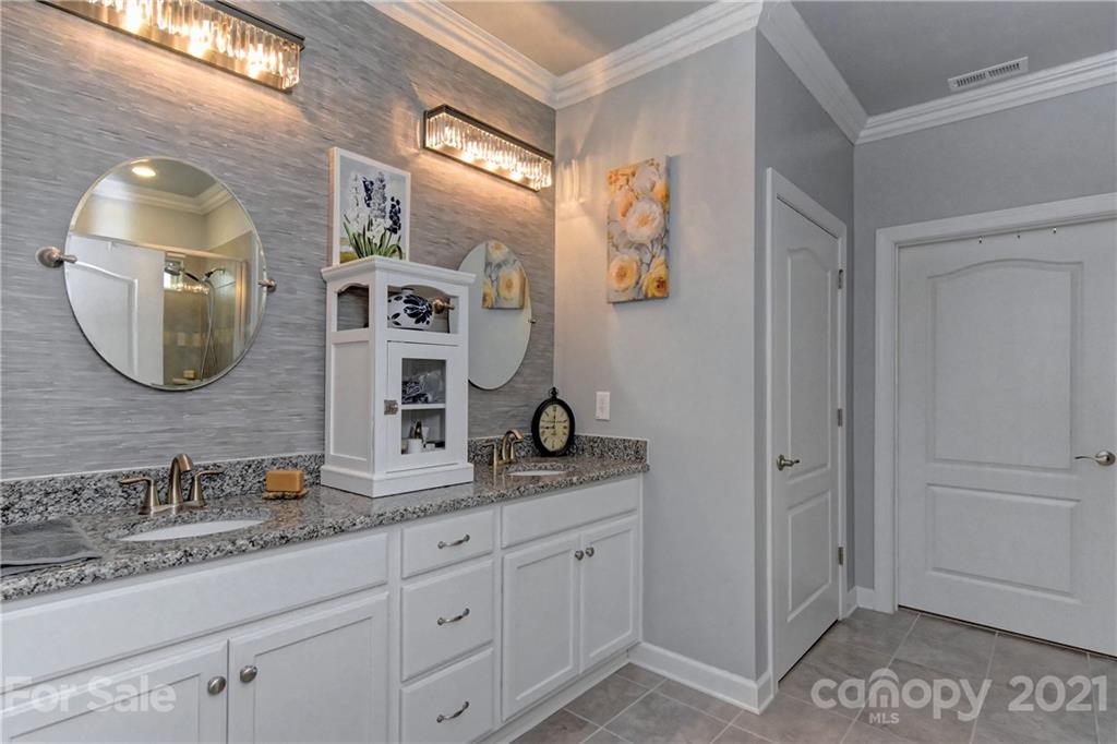 4978 Samoa Ridge Drive Lancaster, SC 29720 - Photo 23 of 38 a bathroom with a granite countertop double vanity sink and a mirror