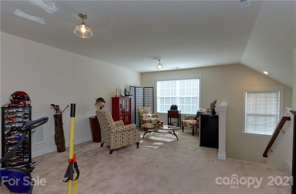 4978 Samoa Ridge Drive Lancaster, SC 29720 - Photo 25 of 38 a living room with furniture a window and gym equipment