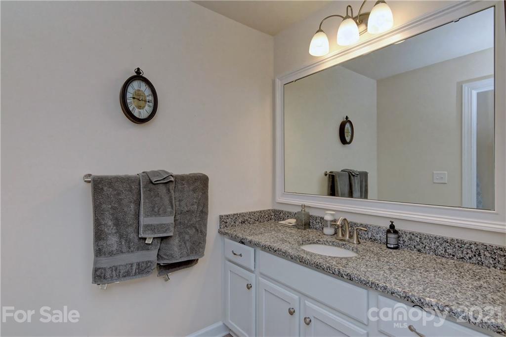 4978 Samoa Ridge Drive Lancaster, SC 29720 - Photo 28 of 38 a bathroom with a granite countertop sink and a mirror