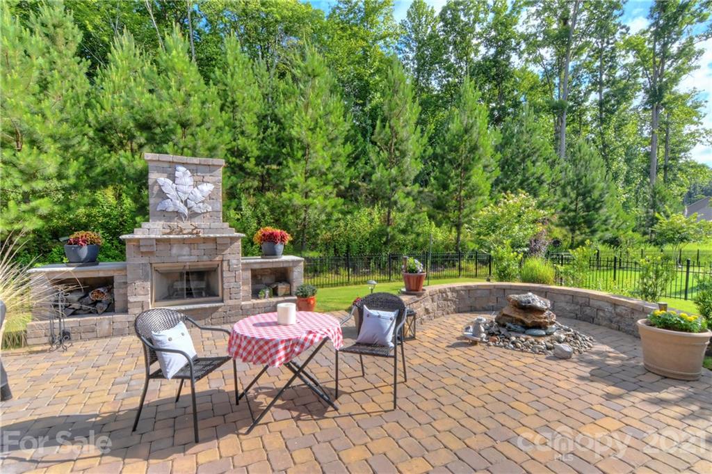 4978 Samoa Ridge Drive Lancaster, SC 29720 - Photo 31 of 38 a patio with table and chairs and potted plants