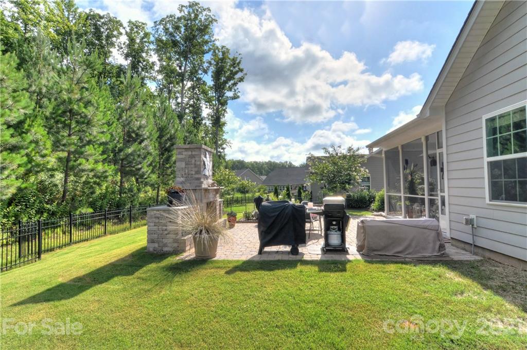 4978 Samoa Ridge Drive Lancaster, SC 29720 - Photo 37 of 38 a backyard of a house with table and chairs