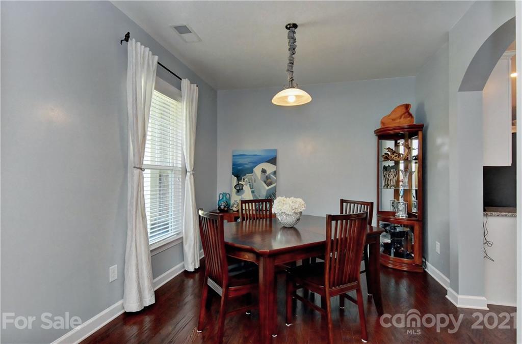 4978 Samoa Ridge Drive Lancaster, SC 29720 - Photo 7 of 38 a view of a dining room with furniture and wooden floor