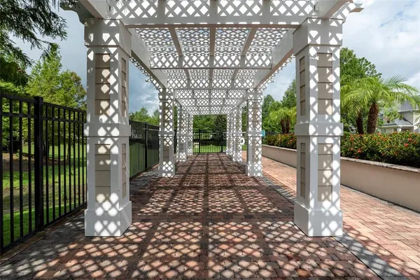 a view of a pathway of a house with a porch