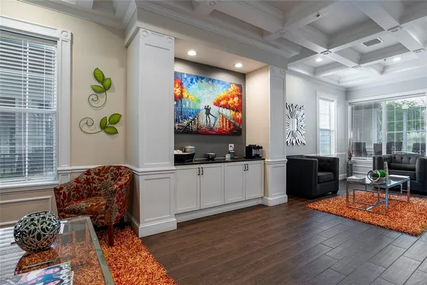 a room with furniture pool table and windows