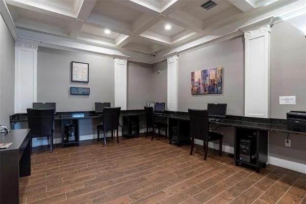 a media room with lots of chairs and a projector screen