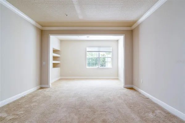 an empty room that has a window