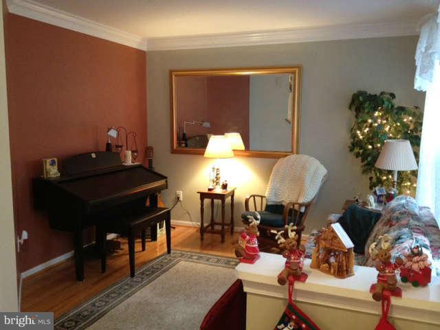 730 Monarch Ridge Road Frederick, MD 21703 - Photo 14 of 30 a living room with furniture and a mirror