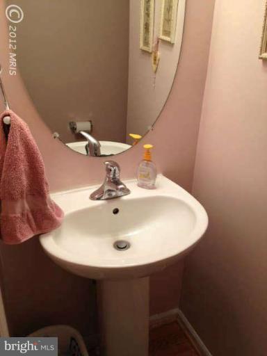 730 Monarch Ridge Road Frederick, MD 21703 - Photo 22 of 30 a bathroom with a sink and a mirror