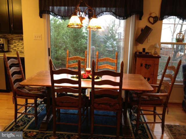 730 Monarch Ridge Road Frederick, MD 21703 - Photo 4 of 30 a view of a balcony dining table and chairs