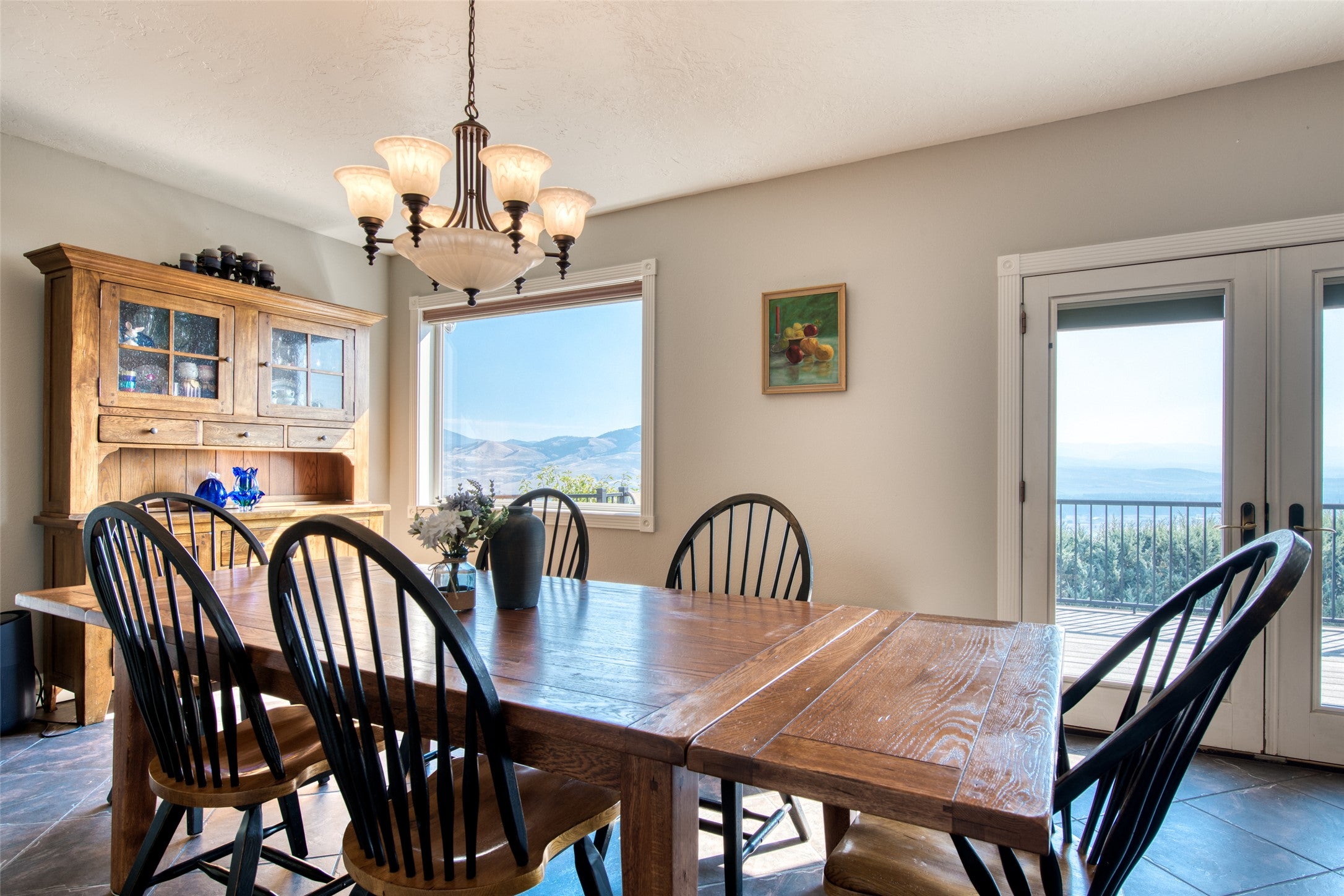 16374 Folsom Road Florence, MT 59833 - Photo 35 of 98 Dining space with french doors, plenty of natural light, and a chandelier