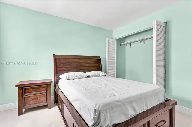 a bedroom with a bed and dresser