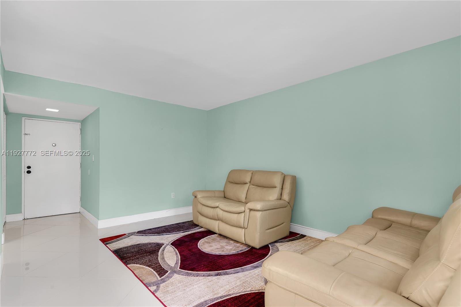 9311 Southwest 4th Street, Unit 105B Miami, FL 33174 - Photo 5 of 19 a living room with furniture and a wooden floor