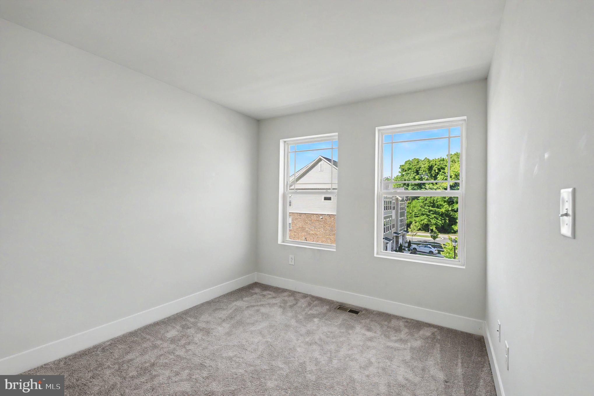 238 Waterstone Road Essex, MD 21221 - Photo 32 of 39 an empty room with windows