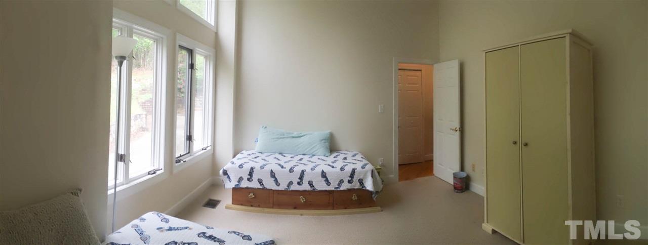 505 Booth Road Chapel Hill, NC 27516 - Photo 15 of 25 a bedroom with a bed and a window