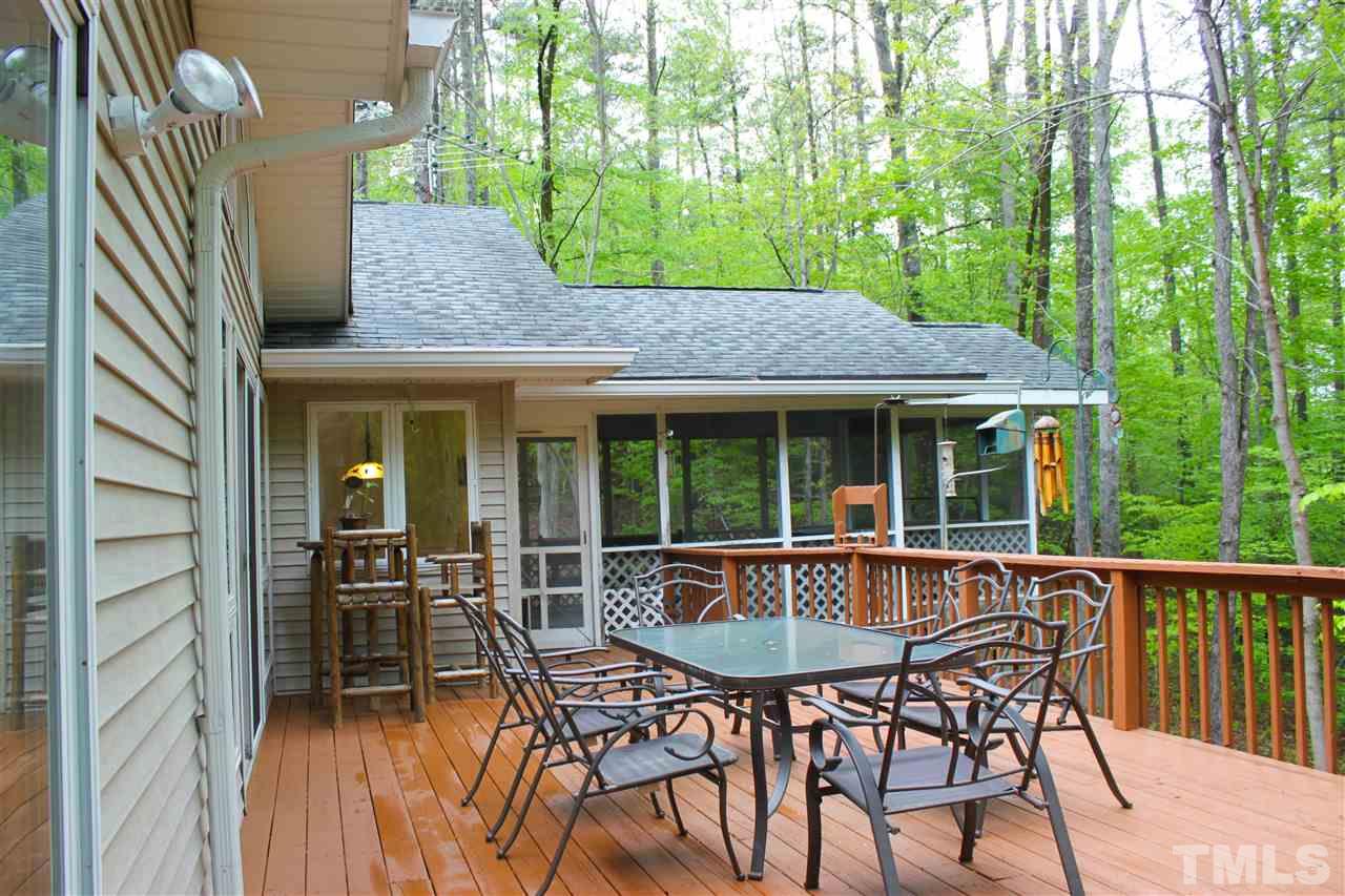 505 Booth Road Chapel Hill, NC 27516 - Photo 19 of 25 a view of a house with backyard and sitting area