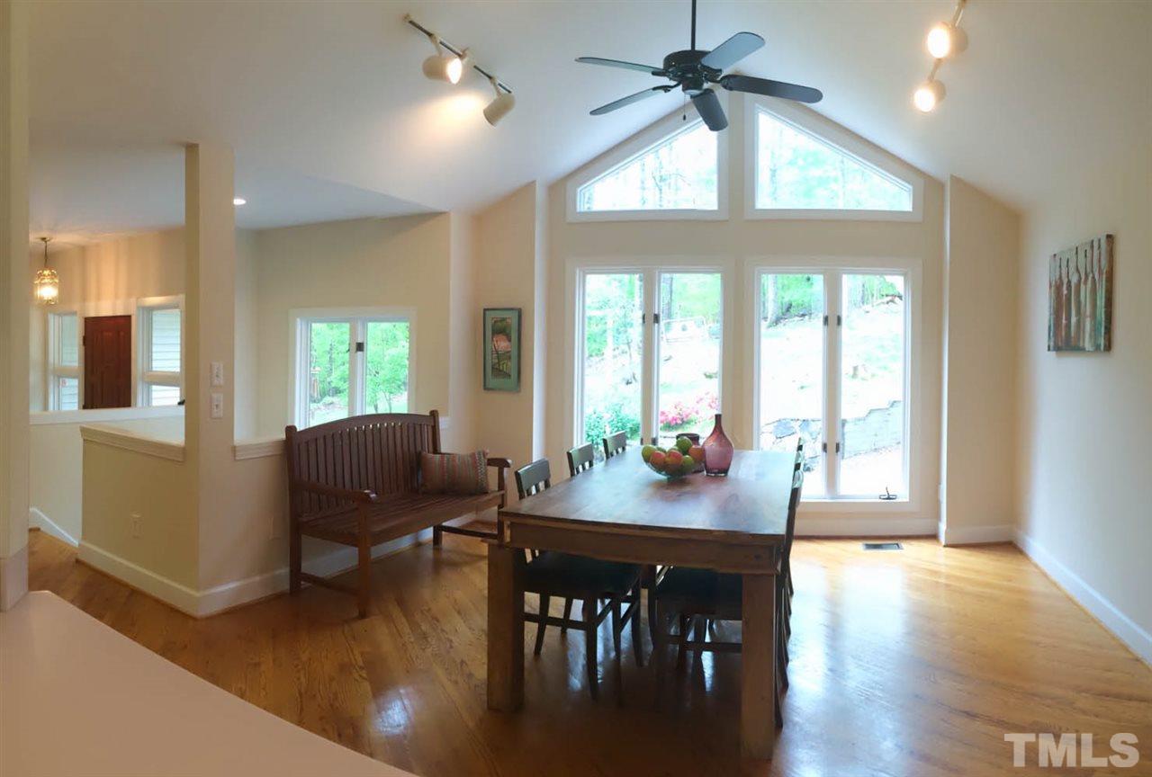 505 Booth Road Chapel Hill, NC 27516 - Photo 4 of 25 a view of a dining room with furniture window and wooden floor