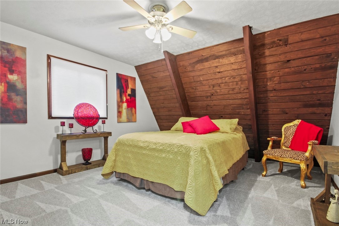 7550 South Raccoon Road Canfield, OH 44406 - Photo 17 of 32 Bedroom featuring ceiling fan and light colored carpet