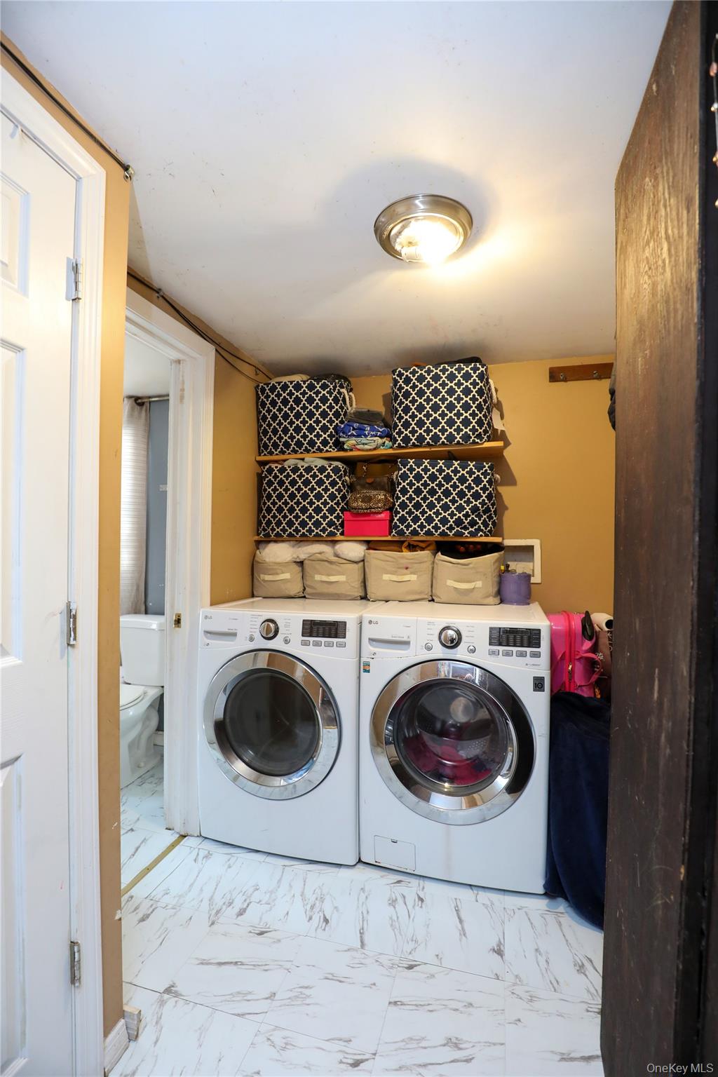 654 Broadway, Unit 9W Esopus, NY 12487 - Photo 12 of 26 a view of a bathroom with washing machine and washing machine