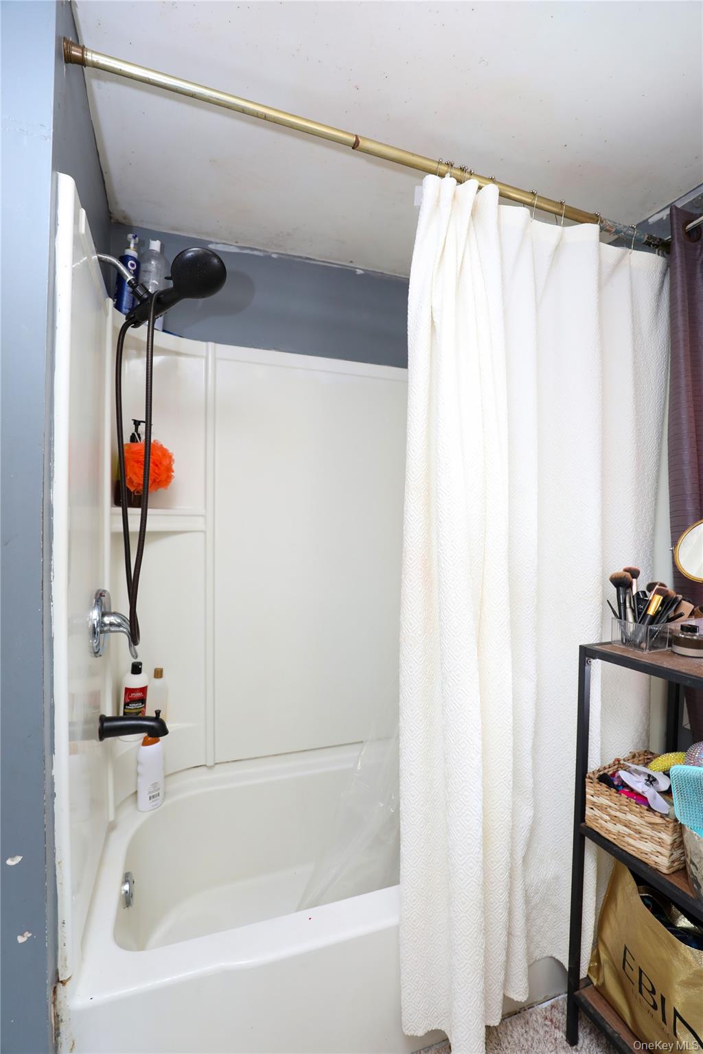 654 Broadway, Unit 9W Esopus, NY 12487 - Photo 15 of 26 a bathroom with a bathtub and a shower