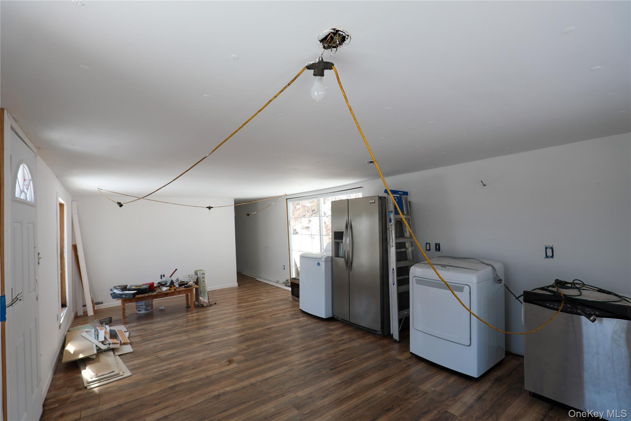 654 Broadway, Unit 9W Esopus, NY 12487 - Photo 22 of 26 a view of a refrigerator in kitchen and wooden floor