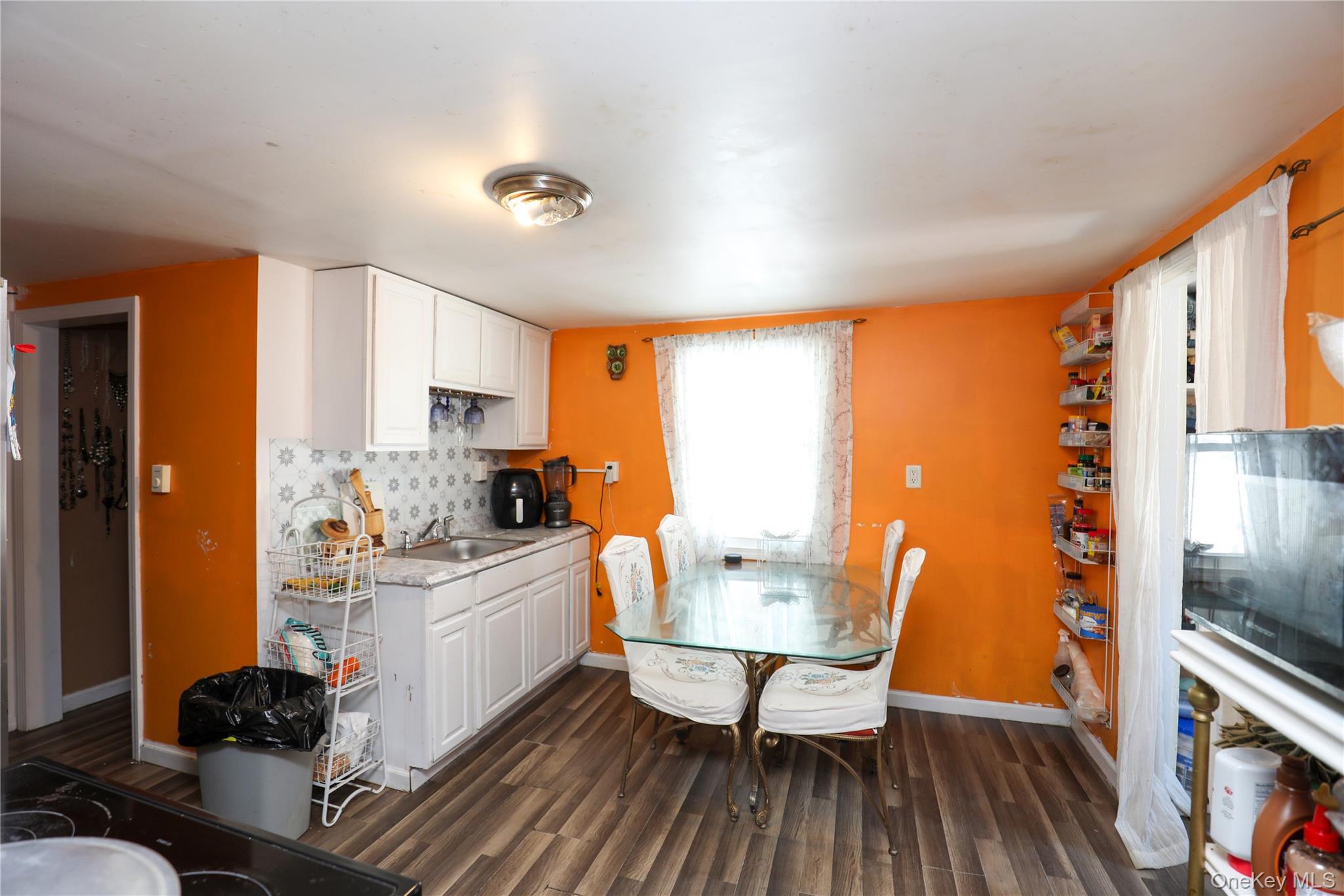 654 Broadway, Unit 9W Esopus, NY 12487 - Photo 7 of 26 a kitchen with a stove a sink and a refrigerator