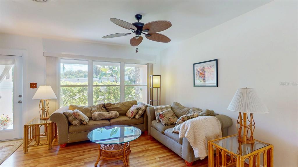 1618 Tuscola Road Clearwater, FL 33756 - Photo 13 of 64 a living room with furniture and a large window