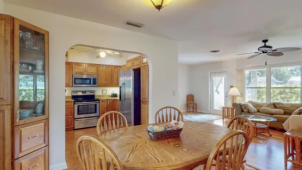 a kitchen with stainless steel appliances granite countertop a sink and a stove