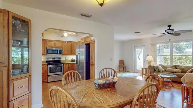 a kitchen with stainless steel appliances granite countertop a sink and a stove