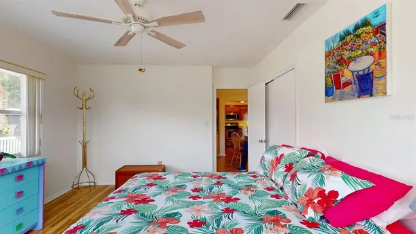 a bedroom with a bed and a window