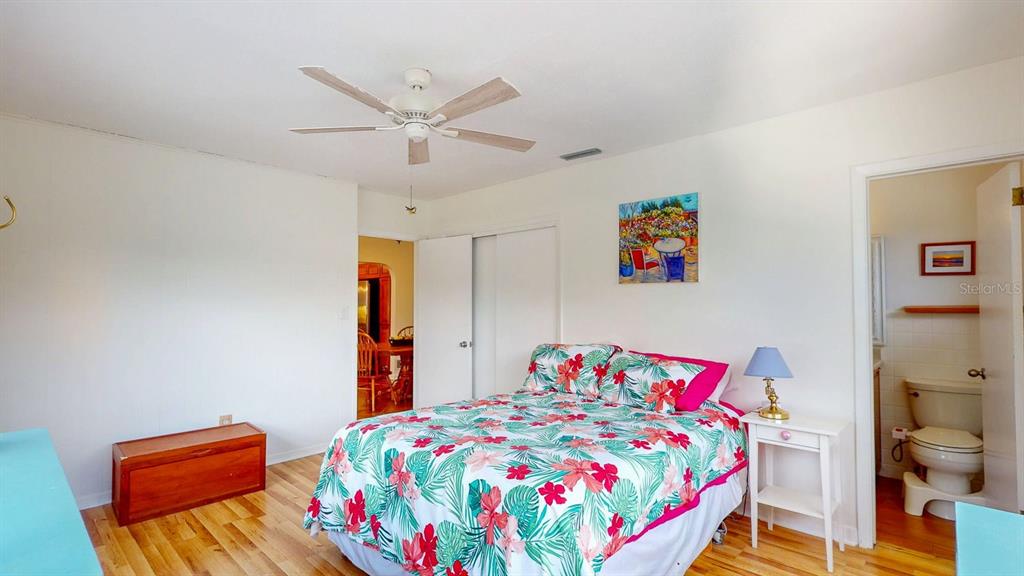 1618 Tuscola Road Clearwater, FL 33756 - Photo 25 of 64 a bedroom with a bed and a table