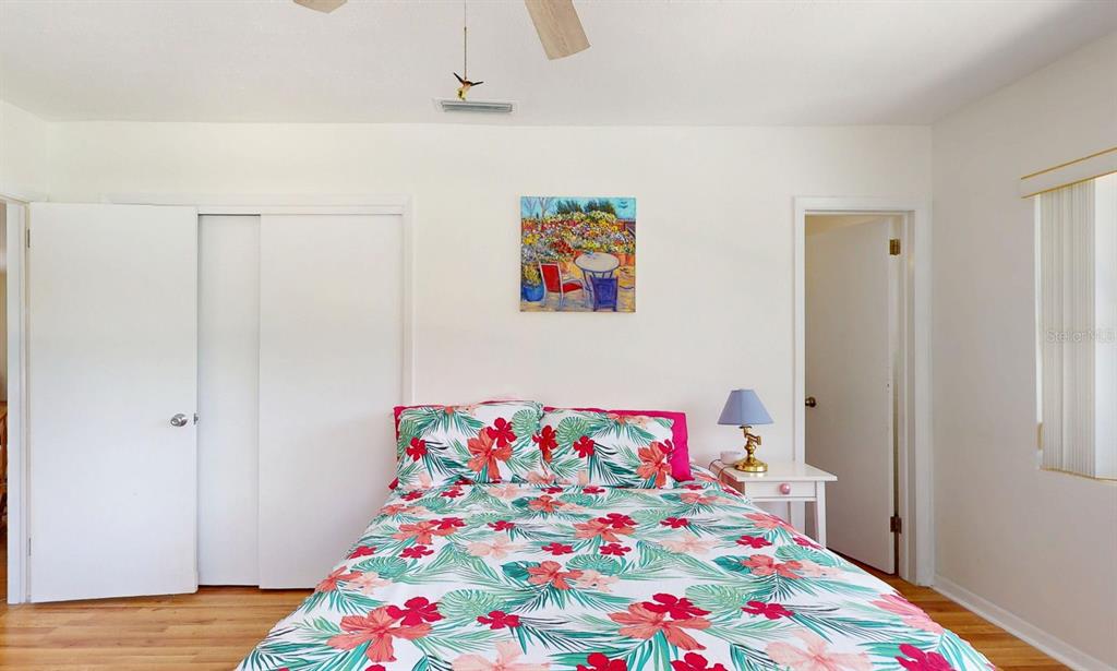 1618 Tuscola Road Clearwater, FL 33756 - Photo 26 of 64 a bedroom with a bed and a dresser in it