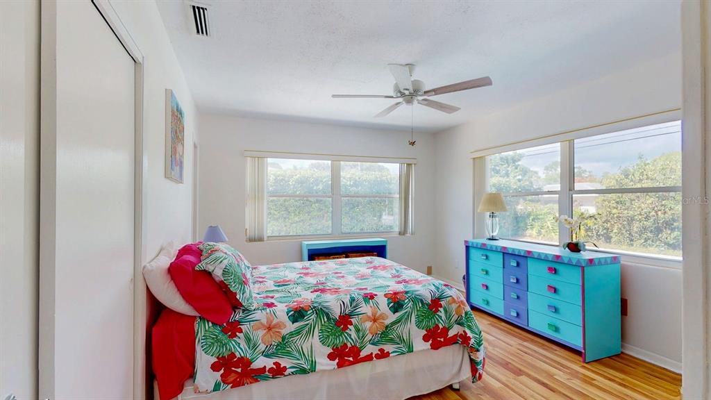 1618 Tuscola Road Clearwater, FL 33756 - Photo 28 of 64 a bedroom with a bed and a window