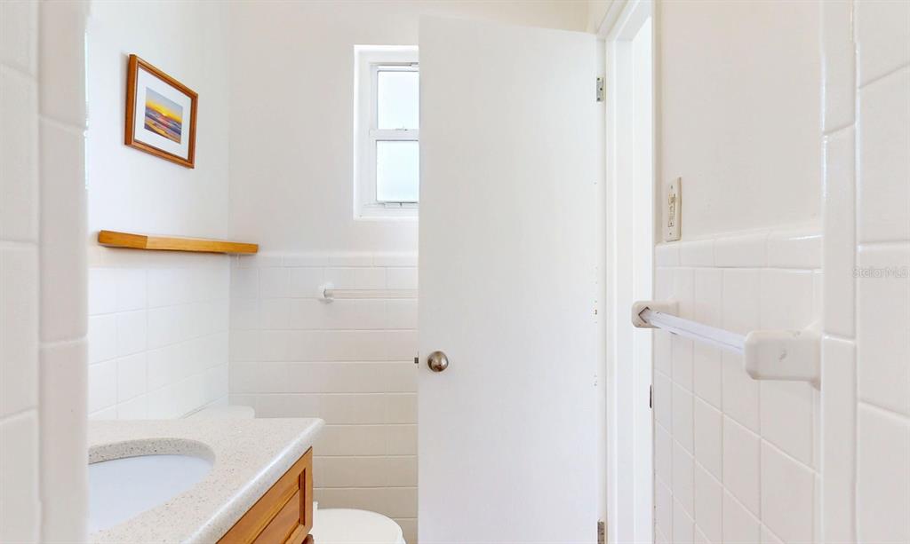 1618 Tuscola Road Clearwater, FL 33756 - Photo 30 of 64 a bathroom with a sink and a toilet