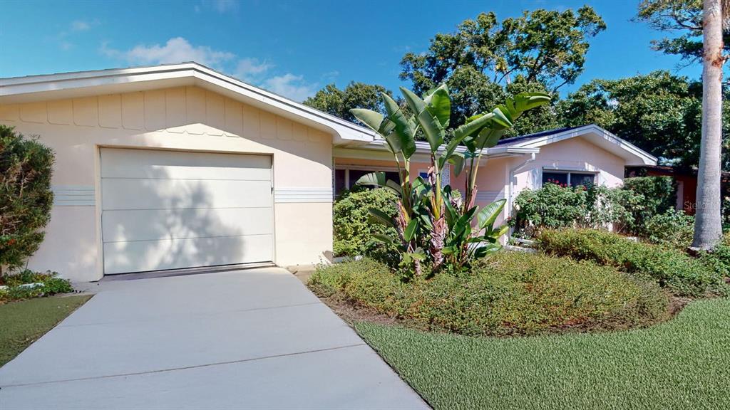 1618 Tuscola Road Clearwater, FL 33756 - Photo 3 of 64 a front view of a house with garden
