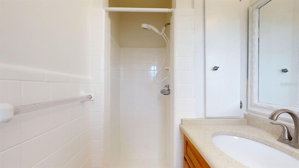 1618 Tuscola Road Clearwater, FL 33756 - Photo 31 of 64 a bathroom with a sink and shower