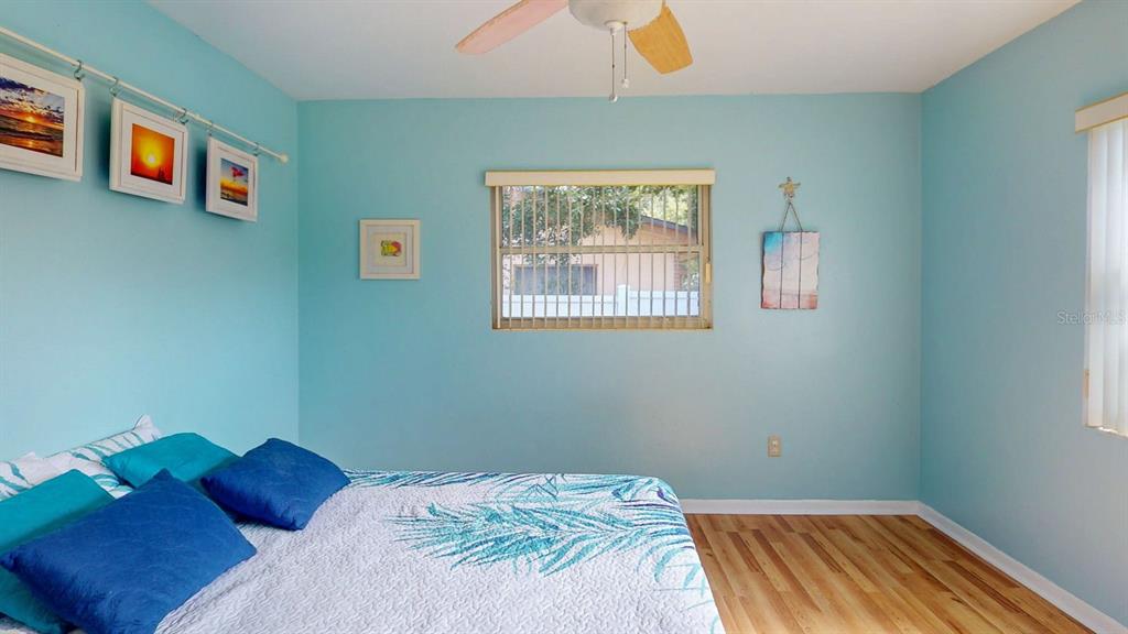 1618 Tuscola Road Clearwater, FL 33756 - Photo 34 of 64 a bedroom with a bed and a window