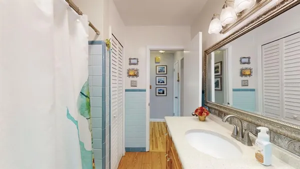 a bedroom with a bed and a lamp