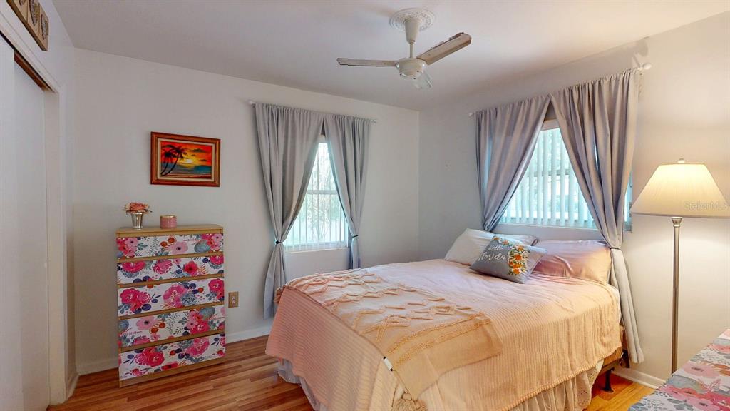 1618 Tuscola Road Clearwater, FL 33756 - Photo 42 of 64 a bedroom with a bed and a window