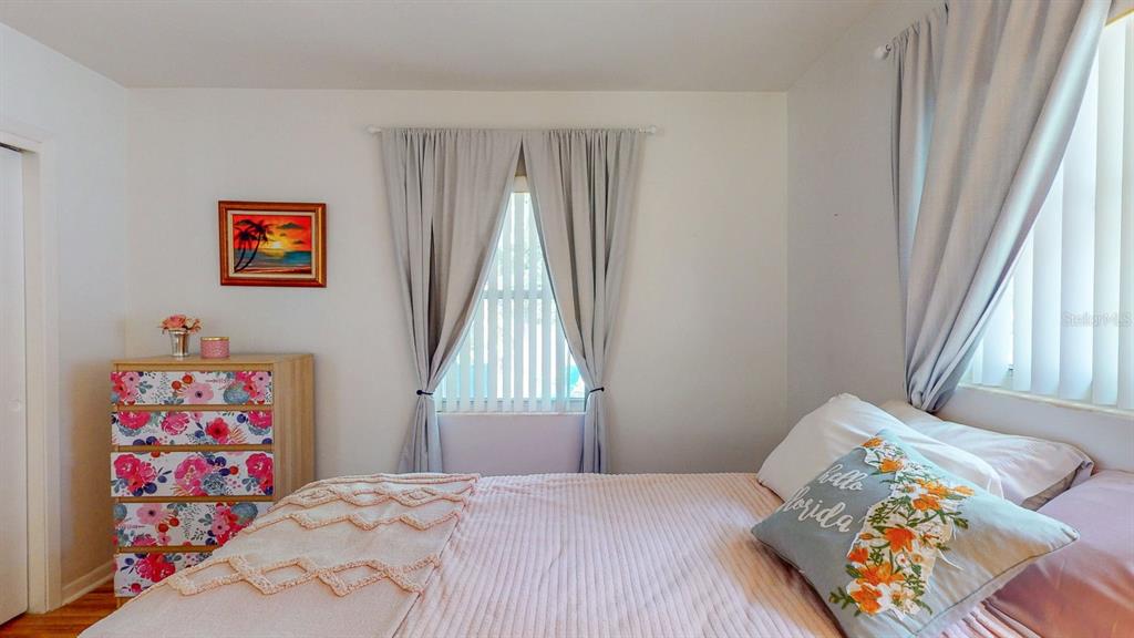 1618 Tuscola Road Clearwater, FL 33756 - Photo 43 of 64 a bedroom with a bed and a window