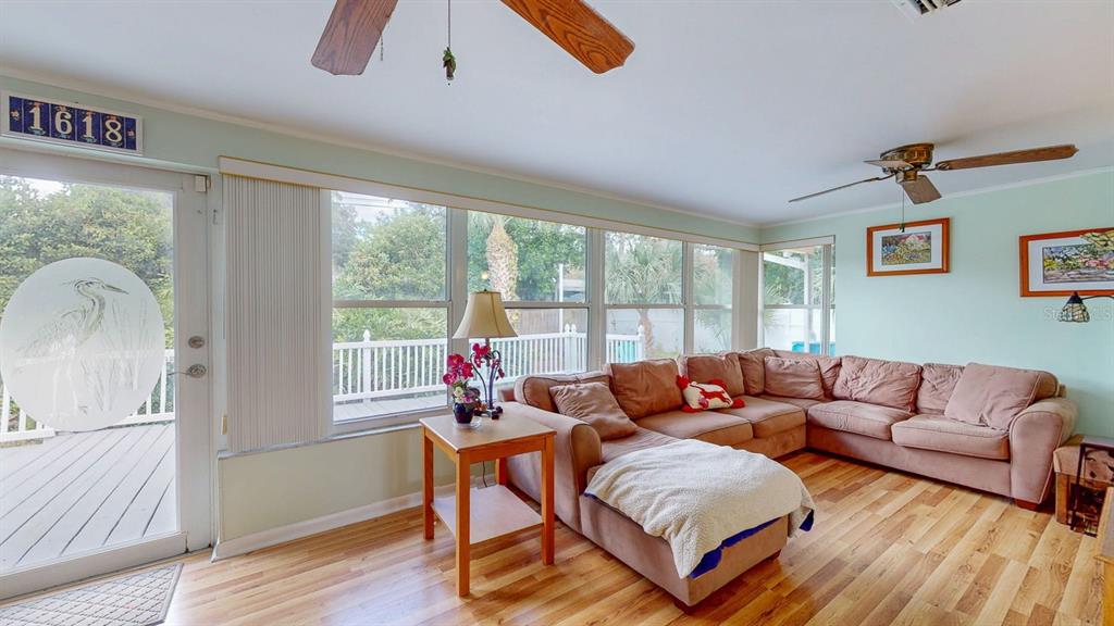 1618 Tuscola Road Clearwater, FL 33756 - Photo 45 of 64 a living room with furniture and a large window