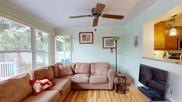 a view of an house with backyard space and balcony